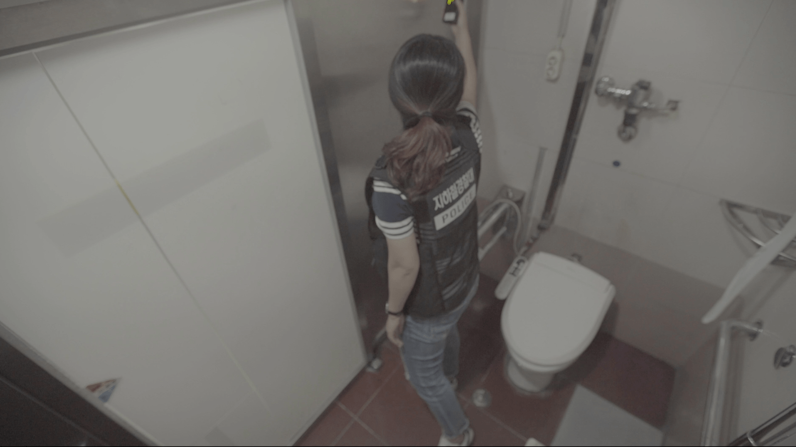 Brunette woman has diarrhea on private toilet.